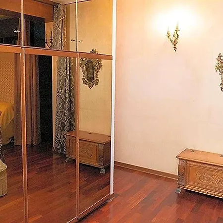 Venitian Style Bedroom With A Shared Bathroom