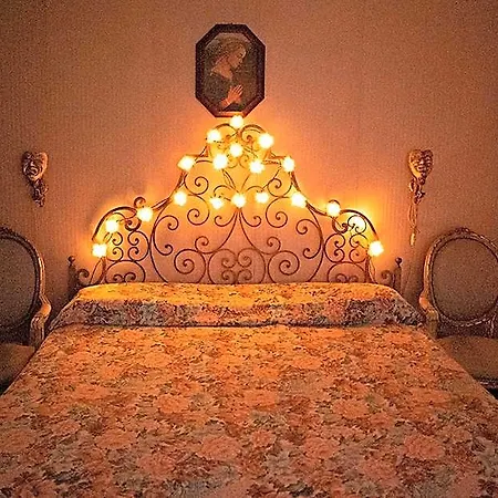 Venitian Style Bedroom With A Shared Bathroom